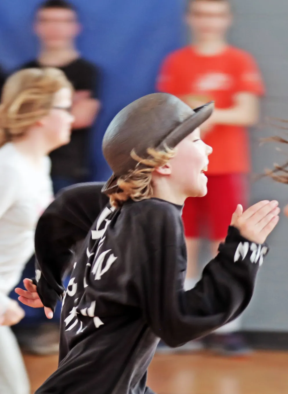Kids running and being active at a YMCA gym