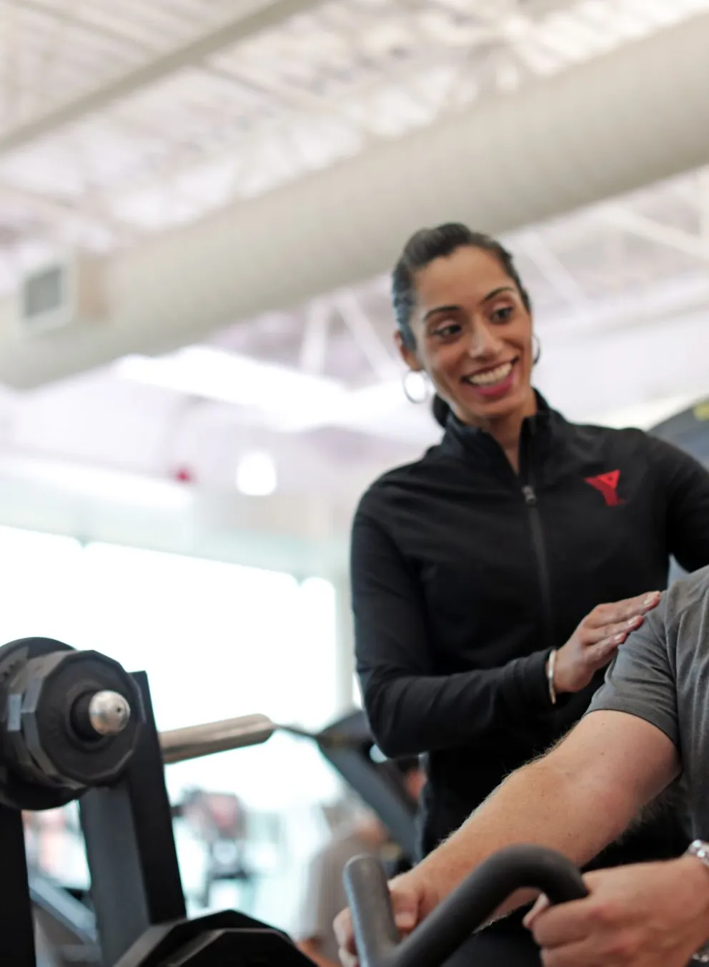Man working out with Y personal trainer