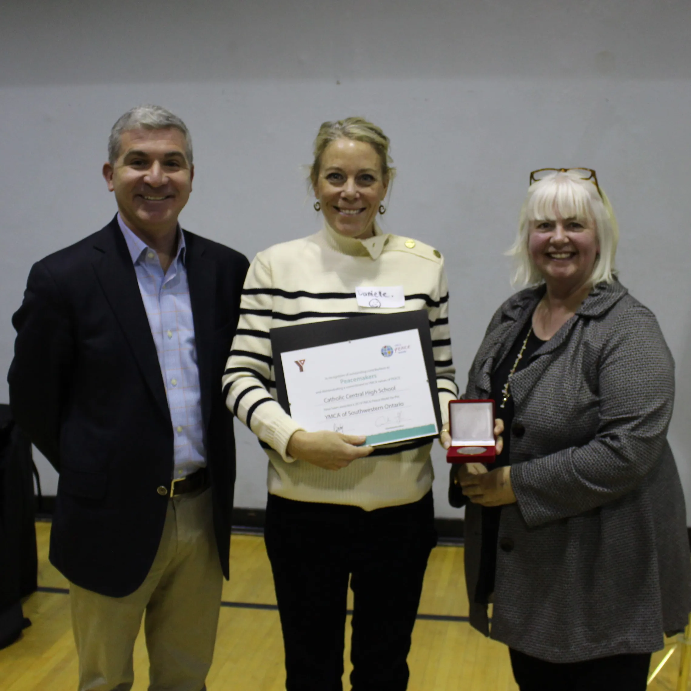 A representative of CCH accepts their award.