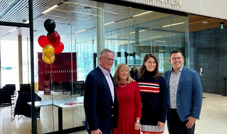 Bierbaum Family stands in front of Community Kitchen