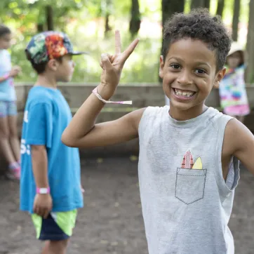 Boy smiling enjoying camp