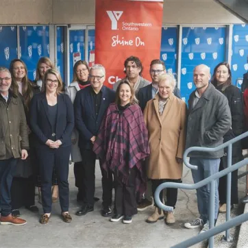 Group of adults at the bottom of a stairwell