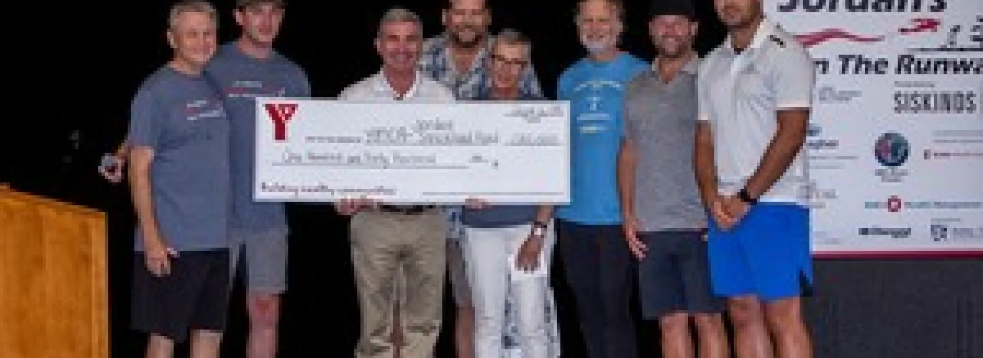 CEO Andrew Lockie receives a cheque towards the event.